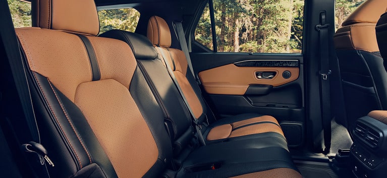 2027 Honda Passport TrailSport Elite featuring brown and black perforated leather rear seats (Mid-Size SUV).